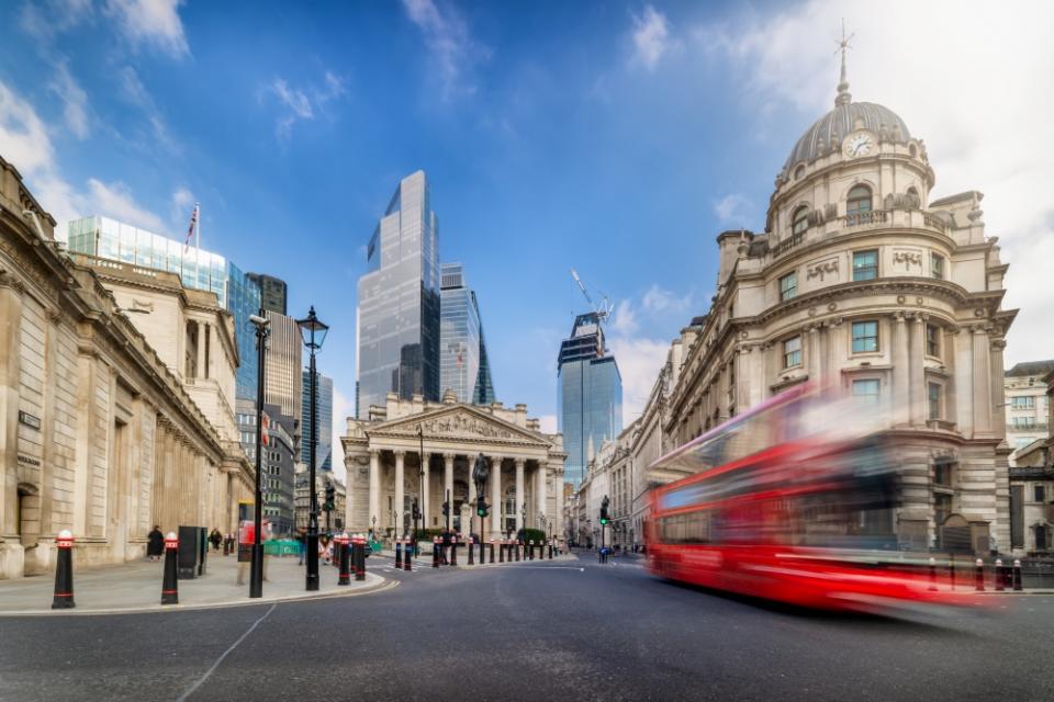 Long exposure view of the City of London with street traffic and the modern office skyscrapers in the background